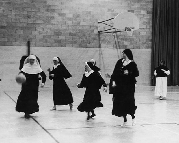 Members of the Order Of The Sisters Of The Cross training on a basketball court at the College Saint-Laurent in Montreal, Canada, July 1962. The nuns are training to be sports teachers and will go on to teach in convents all over Quebec. (Photo by Bob Moyner/Keystone Features/Hulton Archive/Getty Images)